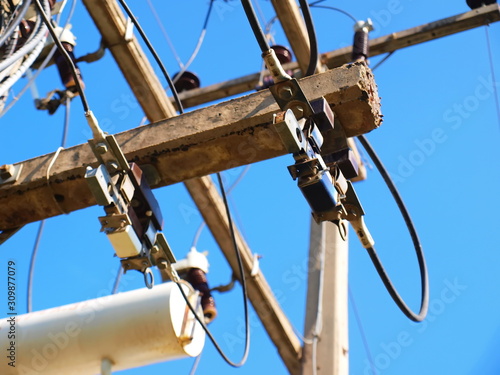 Closeup low tension fuse, two sets on concrete posts, to prevent short circuits On the beautiful blue sky background photo