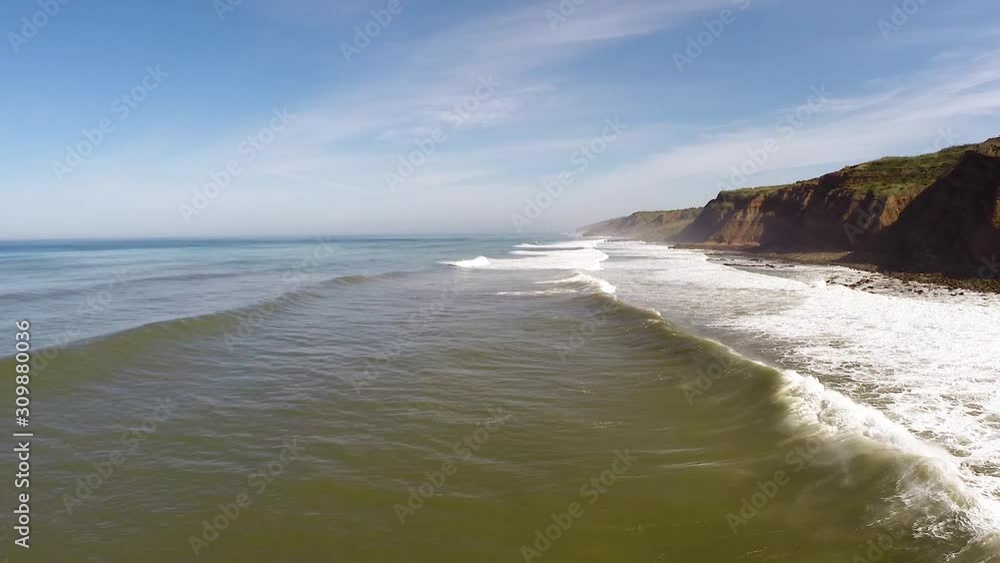 Silver Coast At Western Part Of Portugal Showing A Long Stretch Of Rocky Beach With Small Foamy Waves Touching The Coastline - Wide Shot Silver Coast At Western Part Of Portugal Showing A Long Stretch Of Rocky Beach With Small Foamy Waves Touching The Coastline - Wide Shot