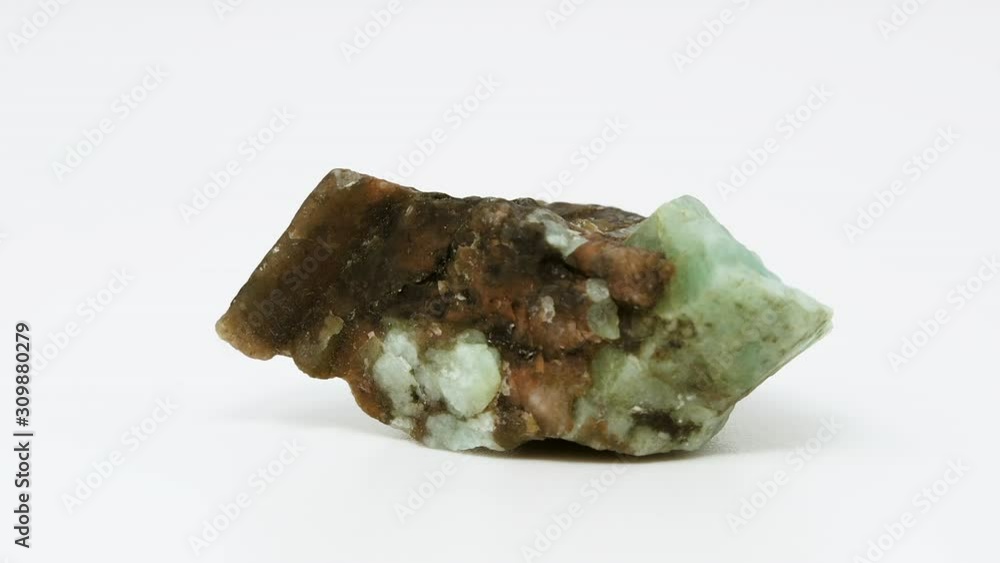 Close view of raw, low grade emerald mineral. Rotating back to front. Close view of raw, low grade emerald mineral. Rotating back to front.