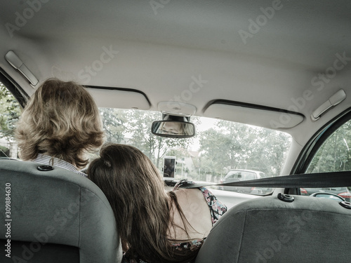 Man and woman embracing in car