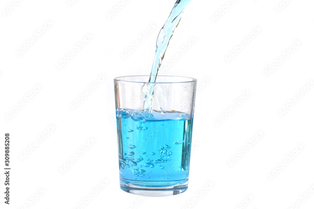 Pour water onto a glass of water with splash isolated on white background Pour water onto a glass of water with splash isolated on white background
