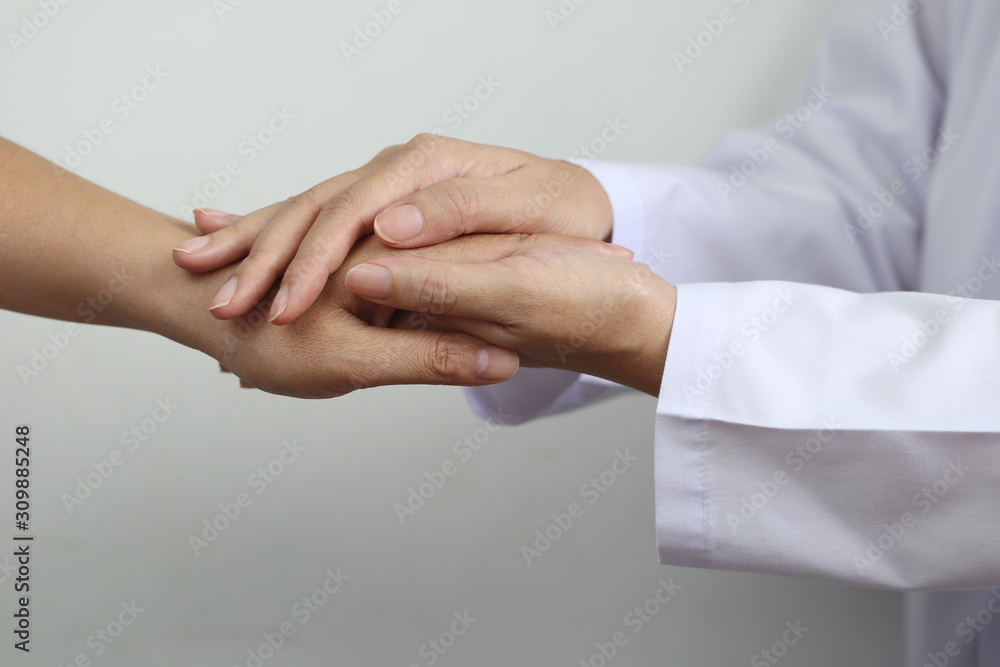 Take care and trust concept, Doctor holding hands of patient at hospital Take care and trust concept, Doctor holding hands of patient at hospital