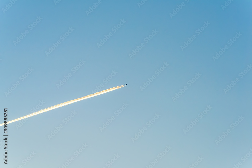 Jet plane flying through clouds at high altitude. Jet plane flying through clouds at high altitude.