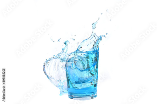 Water splashes in a glass of water isolated white background