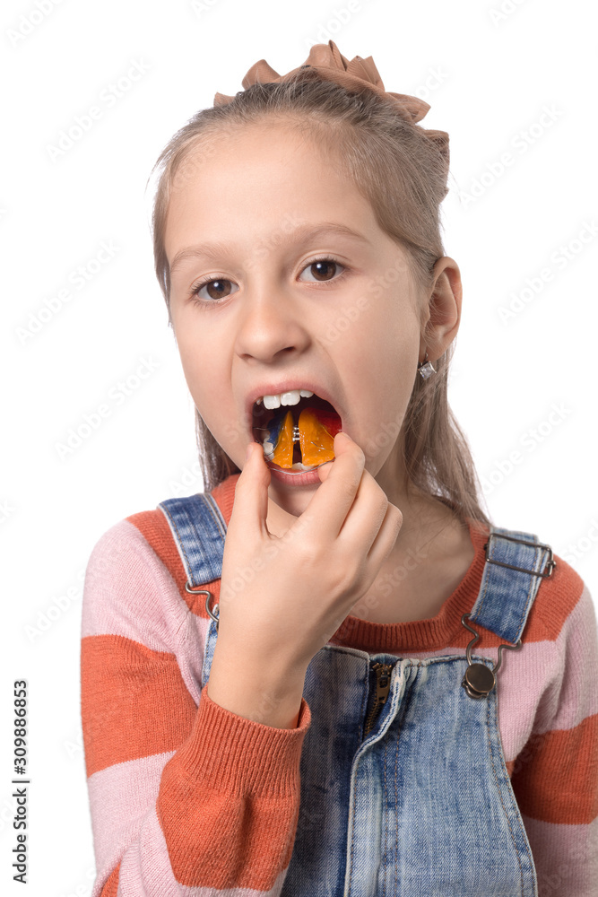 Little girl with orthodontics appliance isolated on white background. Little girl with orthodontics appliance isolated on white background.