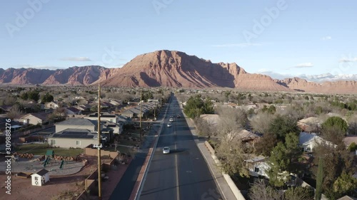 Aerial Drone view of Ivins St George in Utah on a bright sunny winter day showing city in front of red mountains and red cliff national park