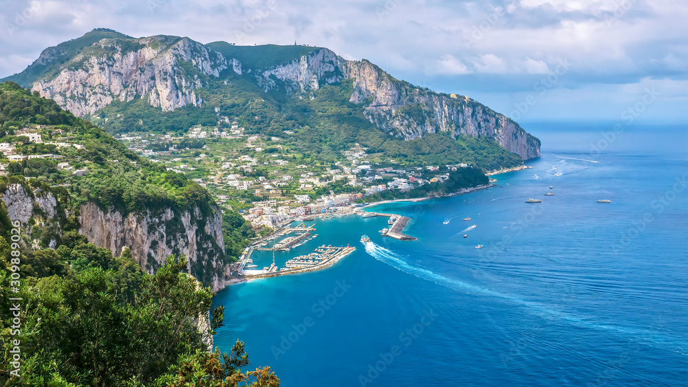 The north side of the beautiful resort island of Capri, with its steep limestone cliffs and azure water.