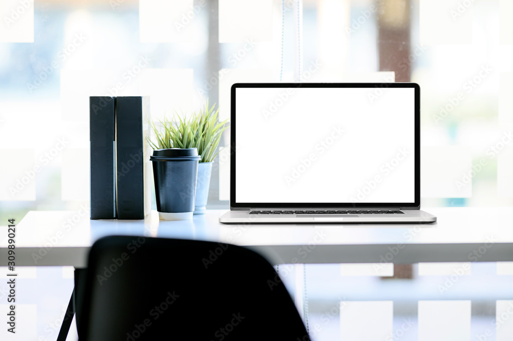Mockup laptop with blank screen and supplies on wooden table. Mockup laptop with blank screen and supplies on wooden table.