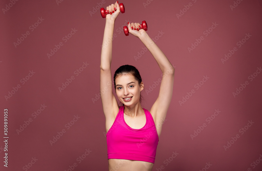 Good-humoured fitness girl dancing in studio. Good-humoured fitness girl dancing in studio.