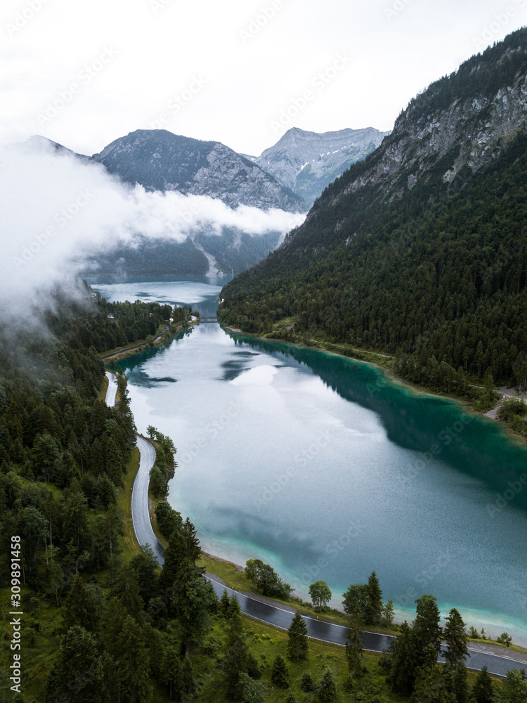 Aerial view of a beautiful lake in Tyrol, Southern Austria,Plansee lake in a foggy day,summer season.