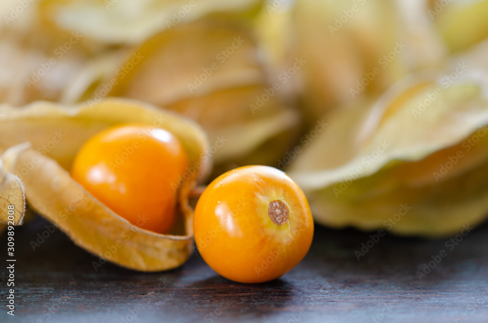 Physalis peruviana or cape gooseberry fruit on wooden table