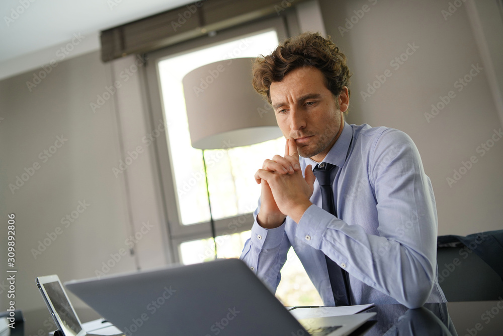 Fototapeta premium Businessman working on laptop meeting room