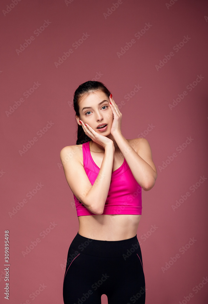 Surprised slender girl in clothes for fitness. Surprised slender girl in clothes for fitness.