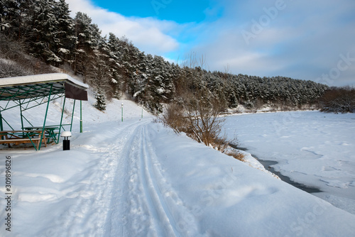 Gazebo for relaxing on the river bank on a winter day © Konstantin