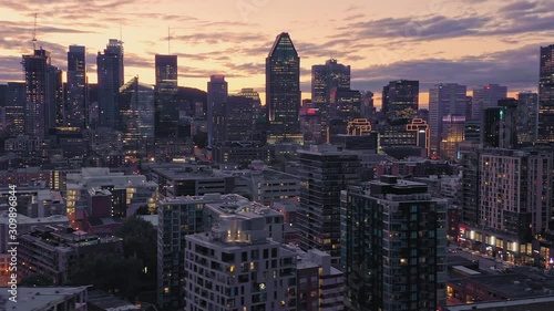 Aerial flying over the Montreal City Skyline at sunset. Quebec, Canada.  photo
