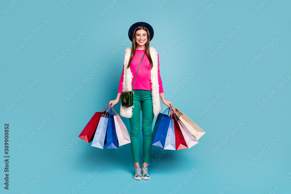 Full length body size view of her she nice attractive lovely cheerful cheery girl carrying new things clothing isolated on bright vivid shine vibrant green blue turquoise color background Full length body size view of her she nice attractive lovely cheerful cheery girl carrying new things clothing isolated on bright vivid shine vibrant green blue turquoise color background