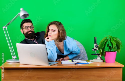 Mature teacher and attractive student. Provocation concept. Private lesson. Flirting with teacher. Student sensual sexy girl and experienced teacher. Teaching pleasure. Making him sexually excited