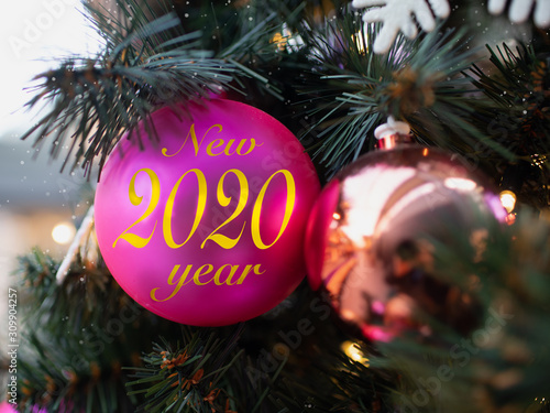 Pink ball with numbers 2020, symbol of coming new year. Happy New Year 2020 concept. © Sinica Kover