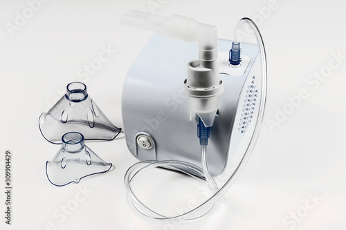 Medical equipment for inhalation with respiratory mask, nebulizer on white background.