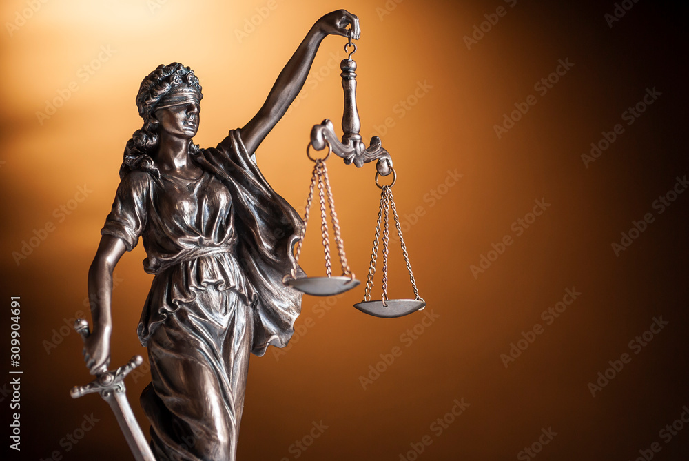 Bronze statue of Justice holding up scales Bronze statue of Justice holding up scales