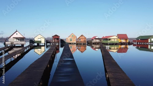 Wooden fishing house on lake