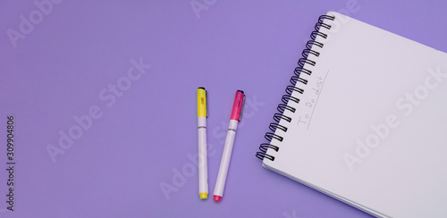 To-Do list banner, notebook and a pen, on a purple background