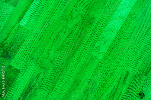 The texture of green from old wooden planks arranged in a vertical order.