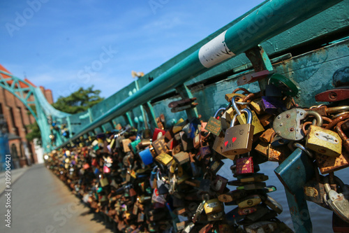 Many locks are hanging on the banister of the bridge in Wroclaw in Poland. Symbolises the love of the lovers. 