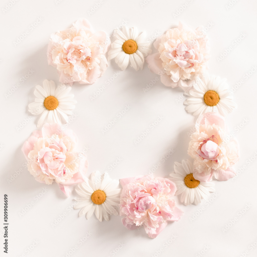 Wreath made of pink peonies and white chamomile flowers Wreath made of pink peonies and white chamomile flowers