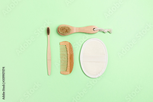 Eco-friendly supplies for personal hygiene. Zero waste composition on green background