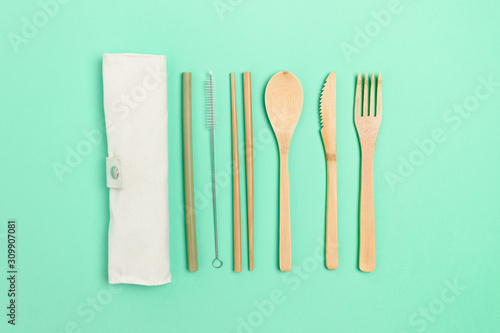 Bamboo cutlery on mint background
