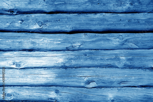 Weathered wooden fence in navy blue tone.