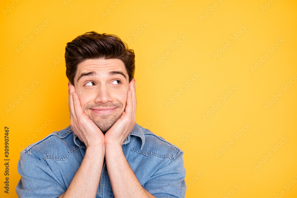 Photo of cheerful cute attractive man looking into empty space waiting for his dreams to come true isolated vivid color background