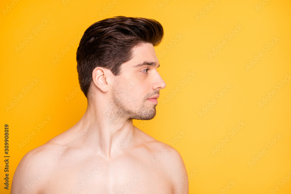 Obraz premium Close-up portrait of his he nice attractive handsome well-groomed pure naked nude guy looking aside daily facial care hydration isolated over bright vivid shine vibrant yellow color background