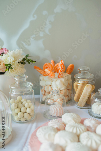 Candy bar at the wedding. Sweets and candies on the festive sweet table