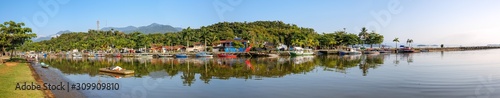 Aerial panorama of estuary of river Perequ  -A  u and area Pontal with mirror reflections of morning sun in Unesco World Heritage town Paraty  Brazil