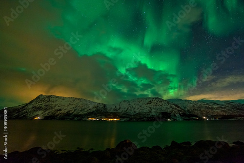 amazing aurora borealis, northern lights, over mountains in the North of Europe - Lofoten islands, Norway