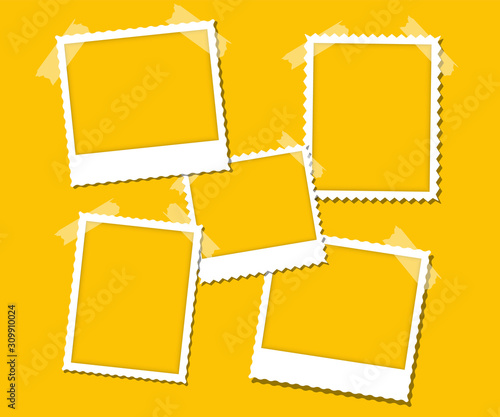 Photo frame with adhesive tape. White frames on the yellow wall. Blank picture for gallery, text, empty mockup, interior, simple image object