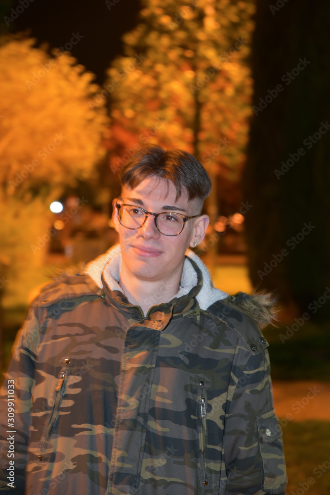 Obraz premium Night Portrait of Man Smiling in the Park