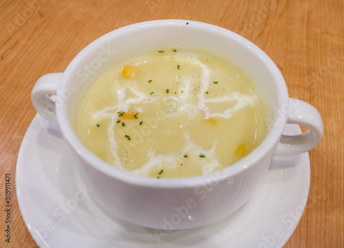 Corn soup in white bowl