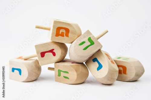 Wooden toy for Hanukkah on white background