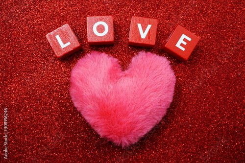 Valentine's Day Background with Love alpahabet letter on red glitter background photo