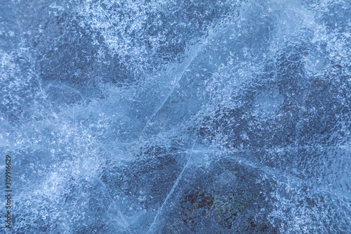 Canvas Print The macro or closeup shot of ice texture or background on the puddle or pool in