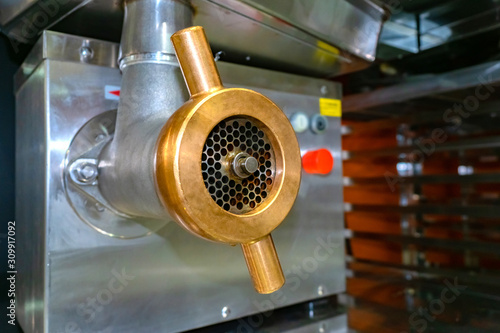Industrial meat grinder. Me...