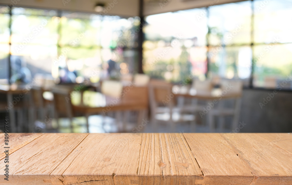 Empty dark wooden table in front of abstract blurred bokeh background of restaurant . can be used for display or montage your products.Mock up for space. Empty dark wooden table in front of abstract blurred bokeh background of restaurant . can be used for display or montage your products.Mock up for space.