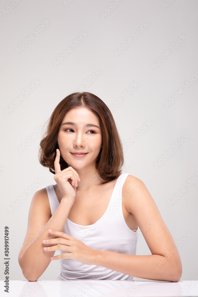Beautiful Asian young woman touching soft cheek smile with clean and fresh skin Happiness and cheerful with positive emotional,isolated on gray background,Beauty and Cosmetics Concept Beautiful Asian young woman touching soft cheek smile with clean and fresh skin Happiness and cheerful with positive emotional,isolated on gray background,Beauty and Cosmetics Concept