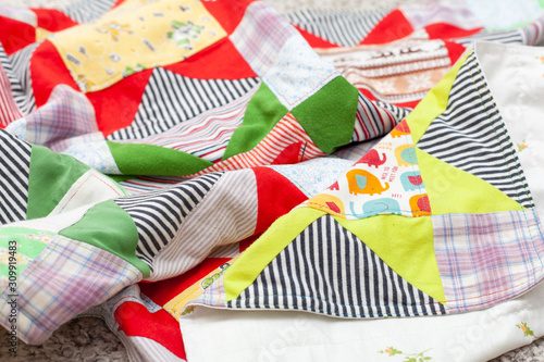 Patchwork, sewing with pieces of fabric, multi-colored segments.
