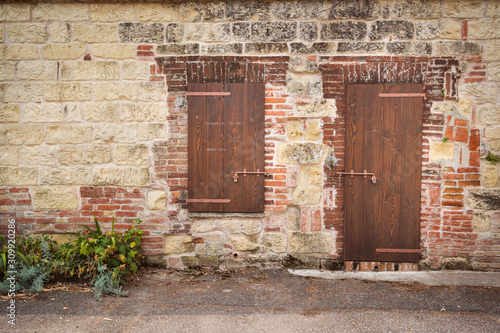 Wooden door and window and a characteristic tuff wall. Moleto, Monferrato photo