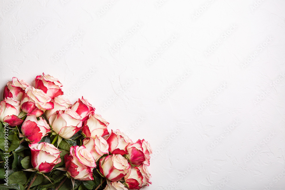 Bouquet of pink roses on white background. Flat lay, top view, copy space. Natural floral background. Bouquet of pink roses on white background. Flat lay, top view, copy space. Natural floral background.