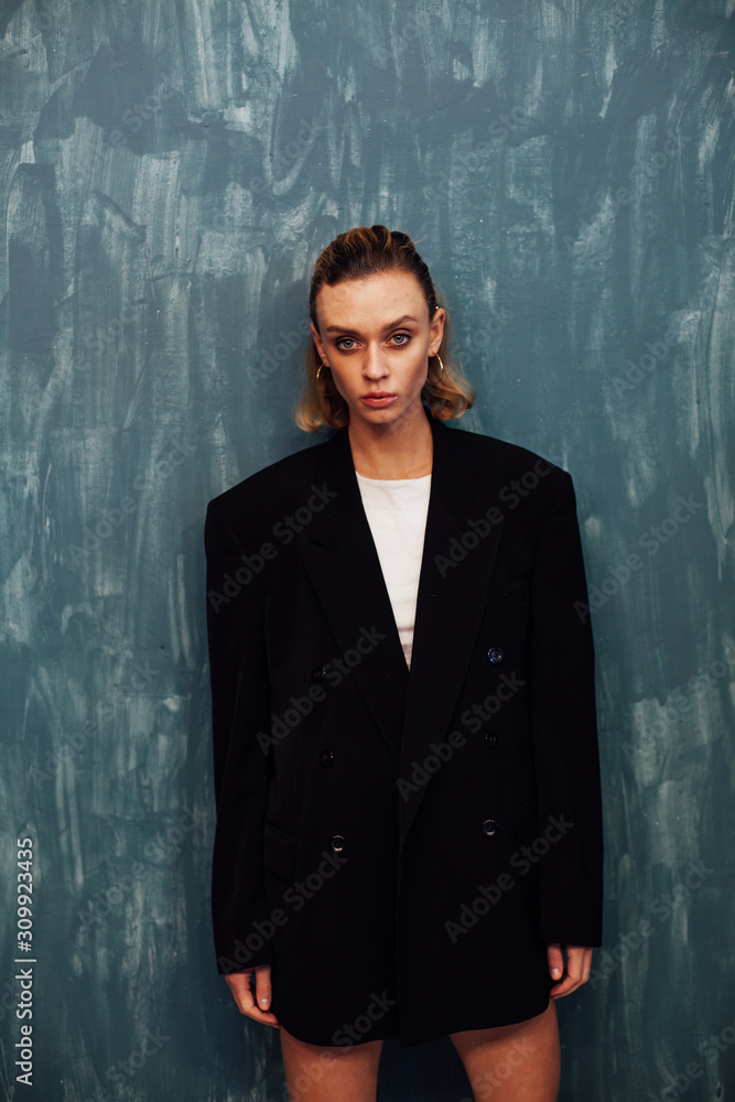 Portrait of a beautiful fashionable blonde woman in a black stylish jacket Portrait of a beautiful fashionable blonde woman in a black stylish jacket